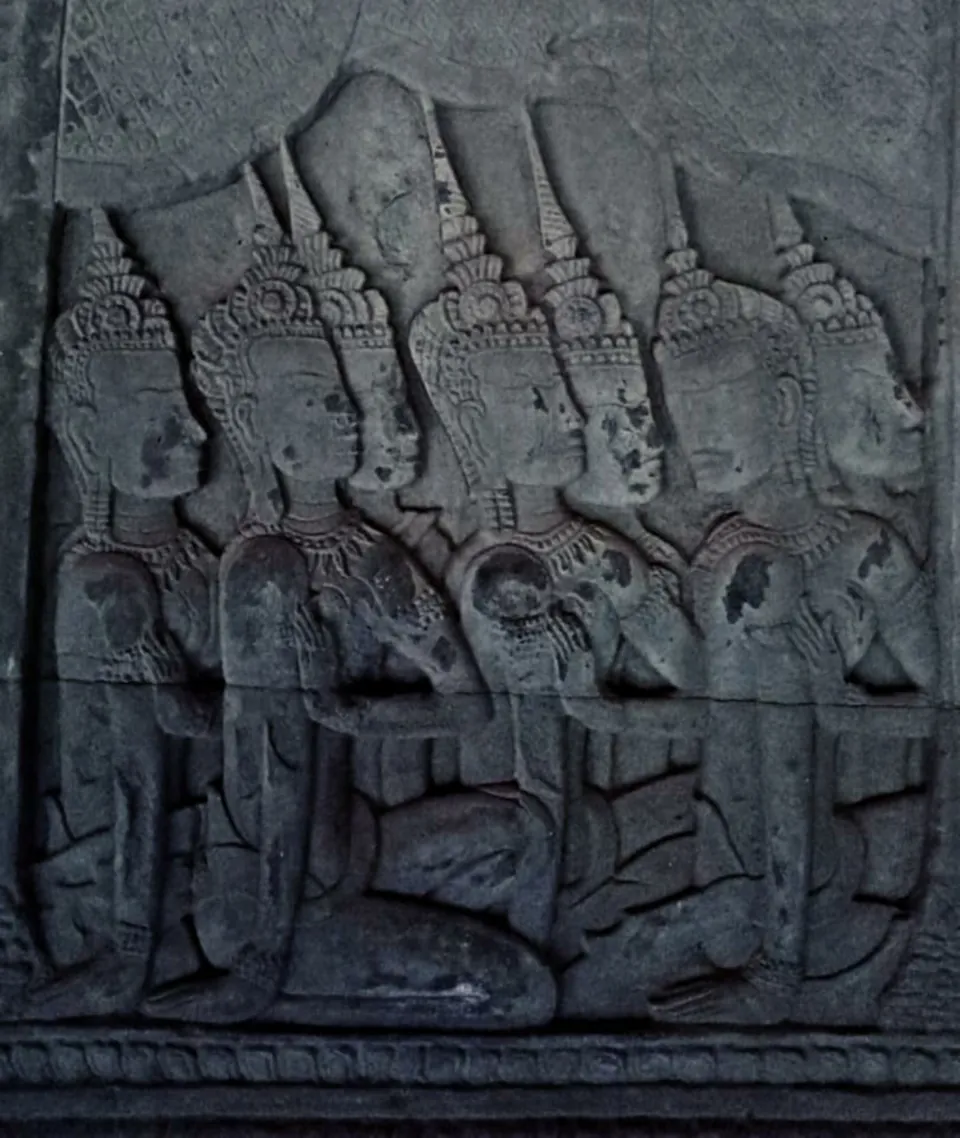 Seated figures with tall crowns carved in Angkor Wat’s southern gallery