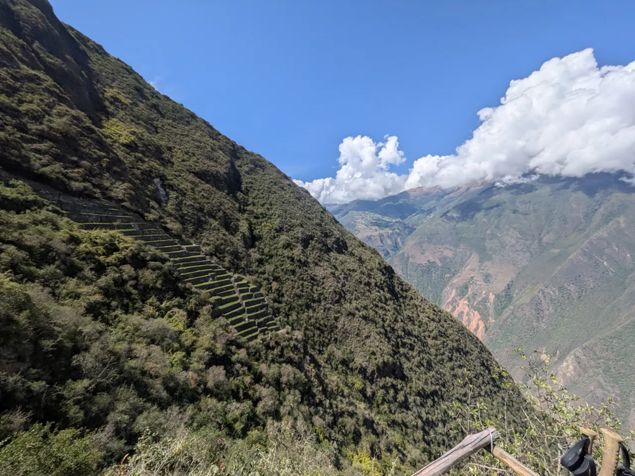 Steep green slopes and terraces at Choquequirao