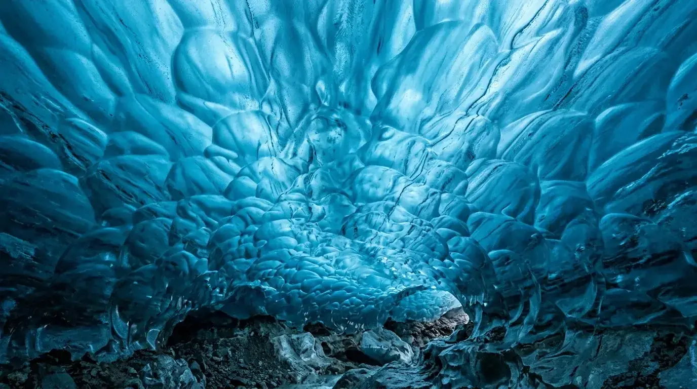 Interpretive AI-created illustration of the scalloped ceiling of a glacier ice cave glowing with light passing down through the ice