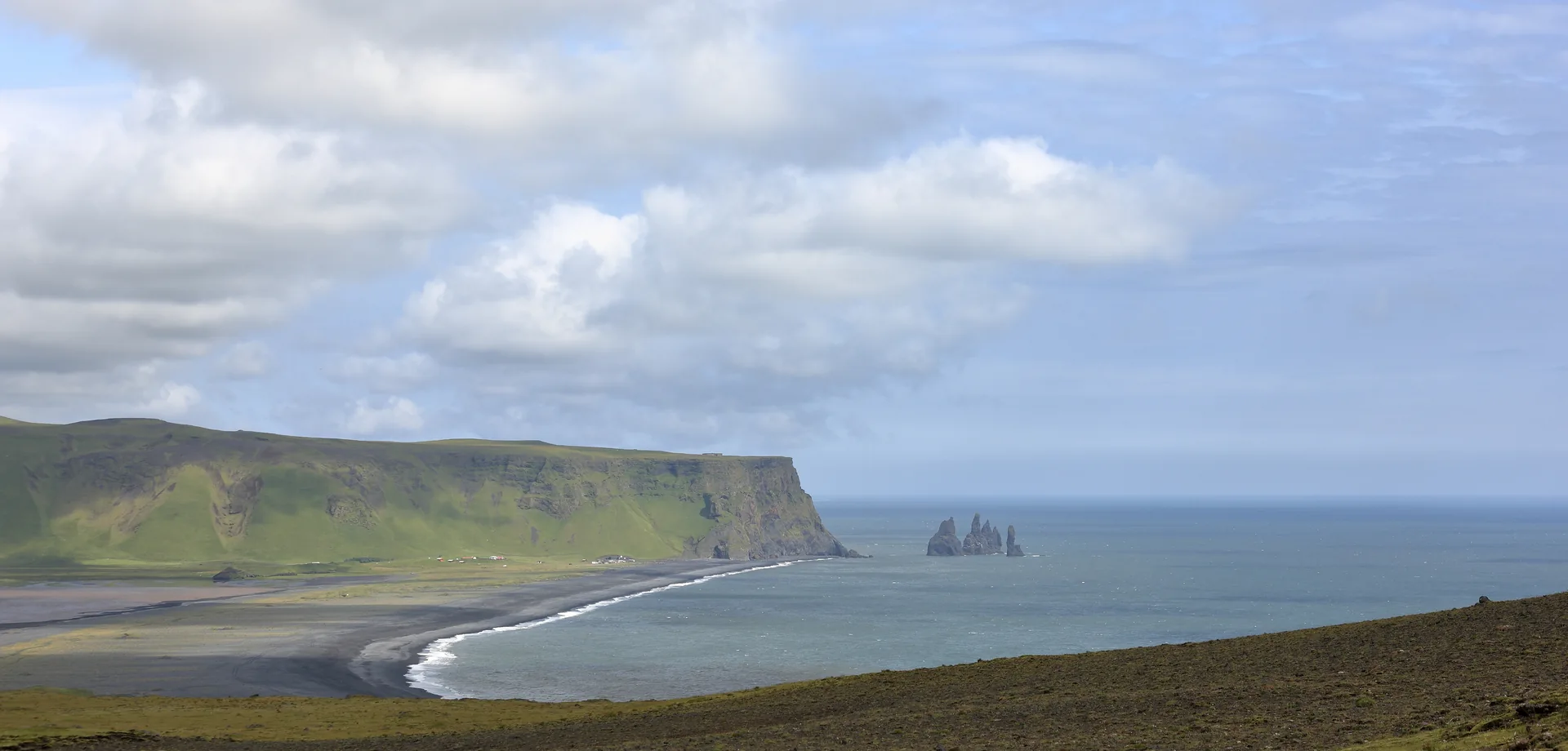 Reynisfjara coastline and Reynisdrangar sea stacks seen from Dyrhólaey in July 2014