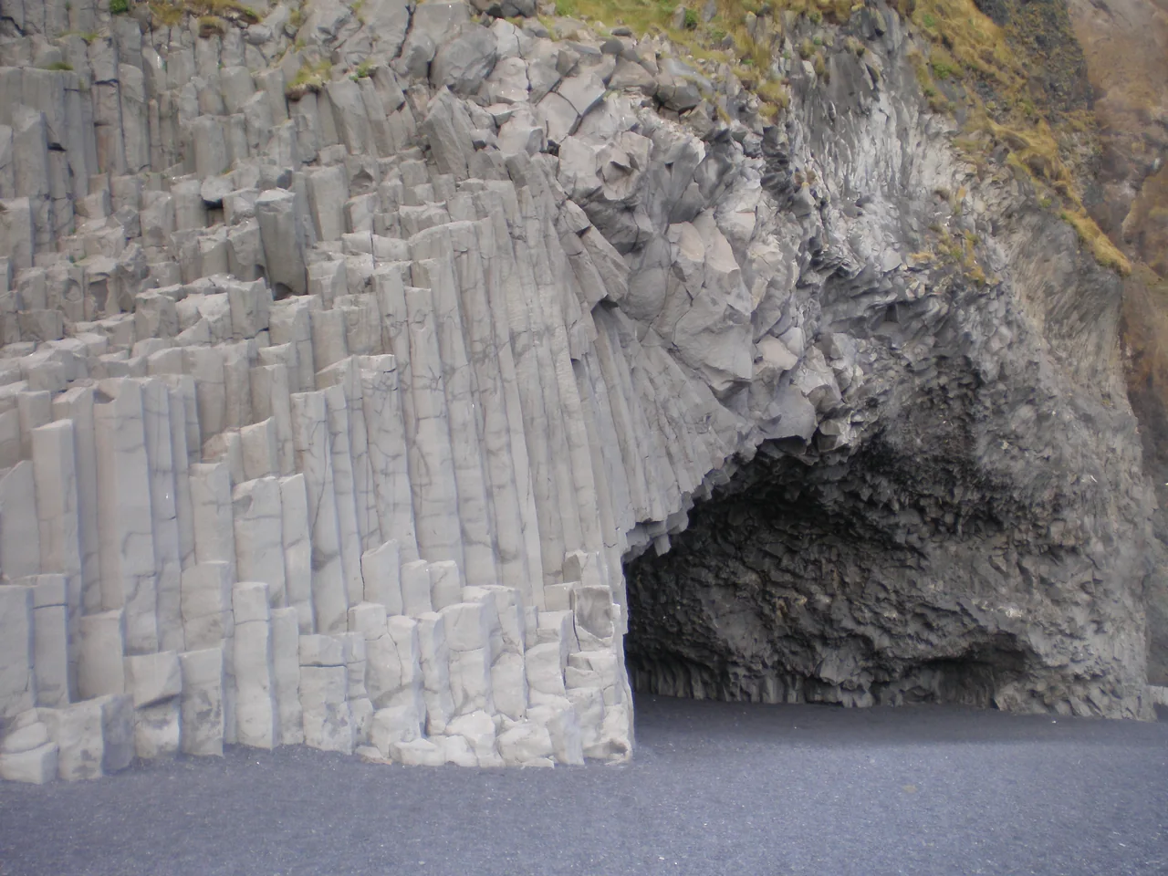 Basalt columns at the entrance to Hálsanefshellir in an archival photograph