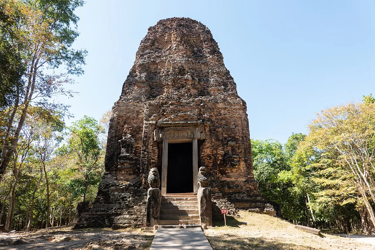 A brick temple with paired lion sculptures at Sambor Prei Kuk in December 2019